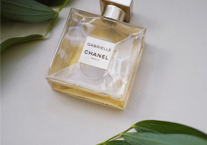 An iamge of Gabrielle Channel Essence perfume bottle lying around